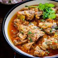 Kadai Lamb · Boneless cubes of spring lamb, cooked with bell peppers, onions, tomato, fresh herbs, and sp...