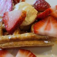 Strawberry Waffle · 1 Belgium waffle topped fresh strawberries, scoop of cheesecake, raspberry sauce and powdere...