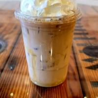 Iced White Mocha · White Chocolate, french press coffee, 2% milk and topped with cream. 12oz