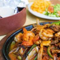 Fajitas Combo · fajitas mix of chicken, steak, chorizo, and shrimp. Comes with rice and beans.