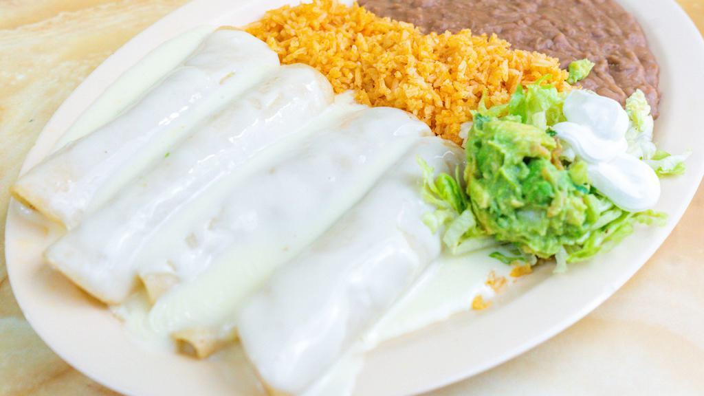 Queso Enchiladas · Queso enchiladas with the choice of meat ( beef or chicken) or only queso