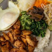 Bibimbop Chicken · Grilled, marinated chicken breast over rice, veggies and fried egg.  Mix throughly and enjoy!