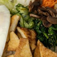 Bibimbop Tofu · Grilled, tofu over rice, veggies and fried egg.  Mix throughly and enjoy!