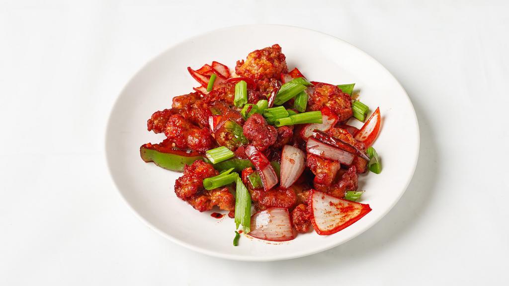 Chilli Chicken (Dry Only) · Batter fried white meat sauteed in soy and chilli sauce.
