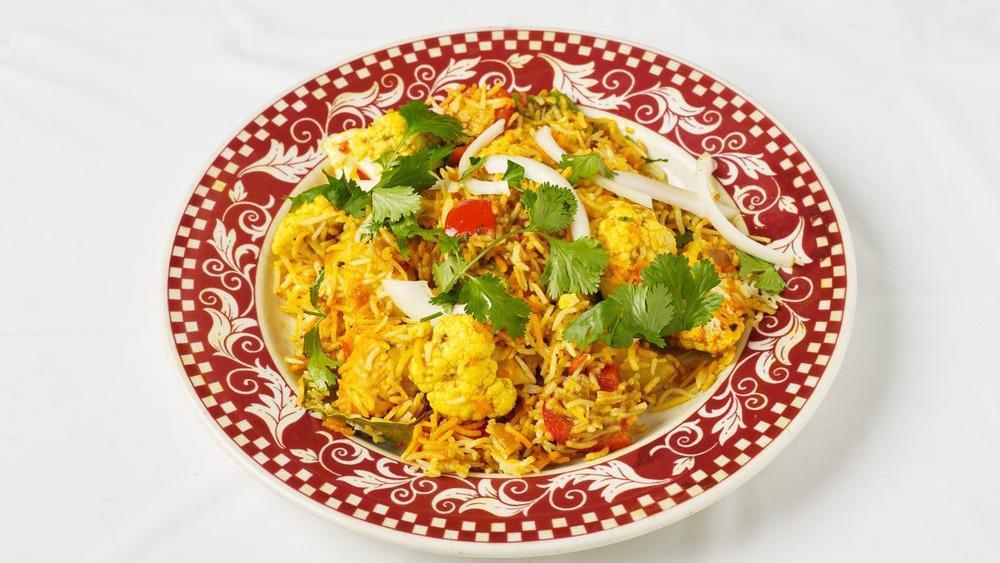 Vegetable Biryani · Vegetables and basmati rice sauteed with spices.
