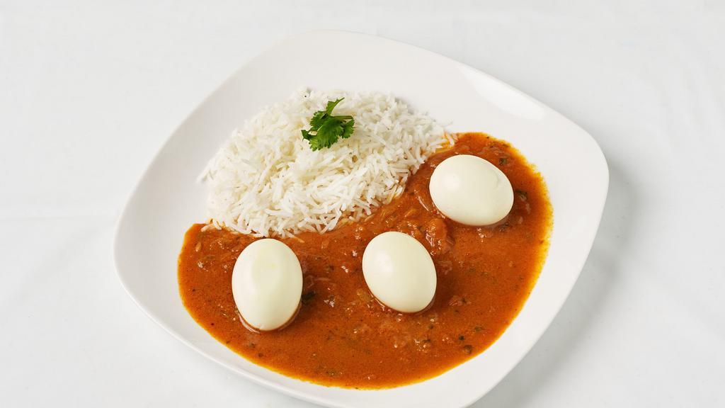 Egg Curry · Boiled eggs cooked in a spicy sauce.