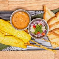 Chicken Satay · Grilled coconut milk, milk-turmeric chicken on skewers served with peanut sauce, cucumber an...