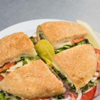 Italiano Panino · Pepperoni, salami, ham, melted provolone cheese, lettuce, tomato, and red onion. Served with...