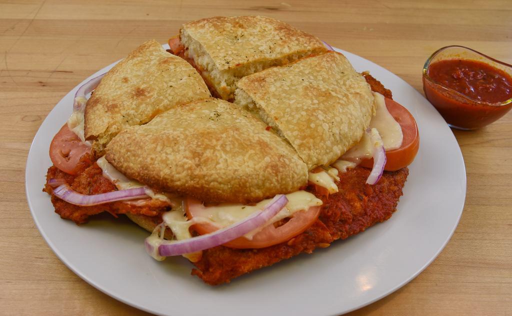 Eggplant Panino · Thin slices of fresh eggplant coated with breadcrumbs, baked with marinara and provolone cheese, topped with tomato and red onion.