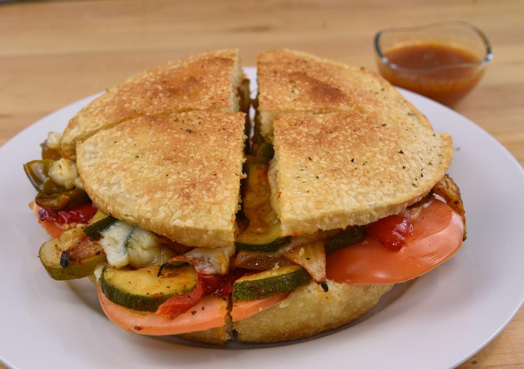 Roasted Veggie Panino · Red & green peppers, onion, provolone cheese, zucchini, tomato.