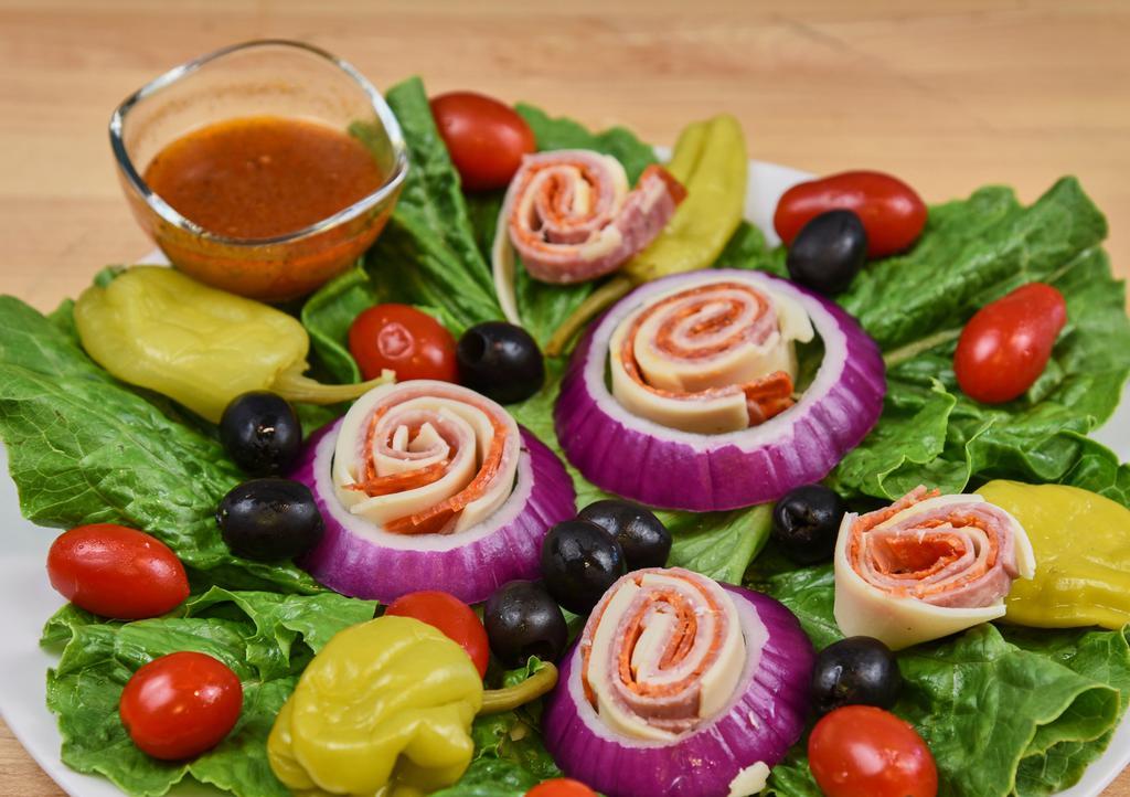 Antipasto Salad · Romaine lettuce, red onion, tomato, black olives, salami, pepperoni, provolone cheese, pepperoncini.