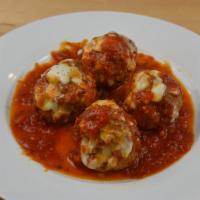 Meatball Dish · Four meatballs in marinara sauce, topped with melted provolone cheese.