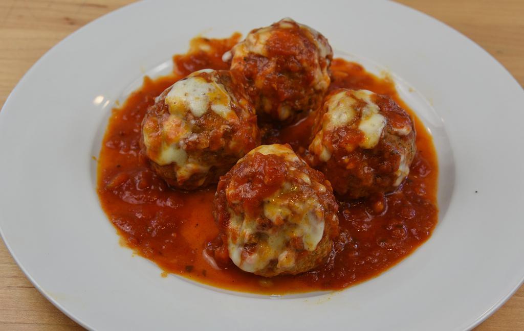 Meatball Dish · Four meatballs in marinara sauce, topped with provolone cheese.