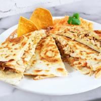 Quesadillas - Queso/Cheese · Large flour tortilla grilled lightly filled with meat; served with rice and beans.