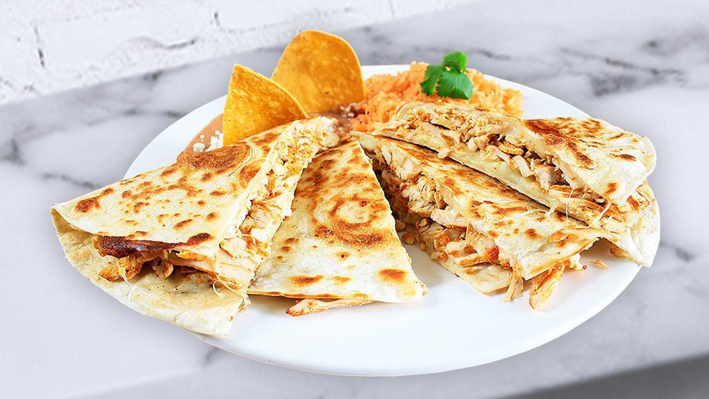 Quesadilla With Meat · Large flour tortilla grilled lightly filled with your choice of meat and served with rice and beans