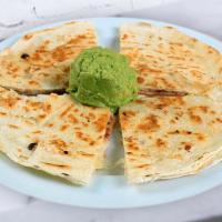 Sincronizadas · Small flour tortilla lightly grilled with ham and cheese served with salsa and avocado.