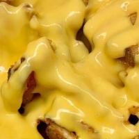 Cheese Fries · Our crispy fries drizzled in melted cheese sauce.