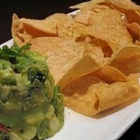 Guacamole And Chips · Hand made Guacamole made with fresh avocados. Served with made to order tortilla or pita chi...
