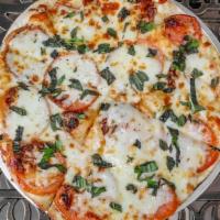 Margarita Pizza · Our blend of five Italian cheeses, ripe sliced tomatoes, fresh basil, and homemade sauce. It...