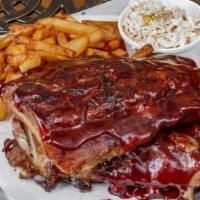 Full Slab Ribs And Fries · Full slab of tender Ribs smothered in our tangy BBQ sauce. Served with choice of fries and s...