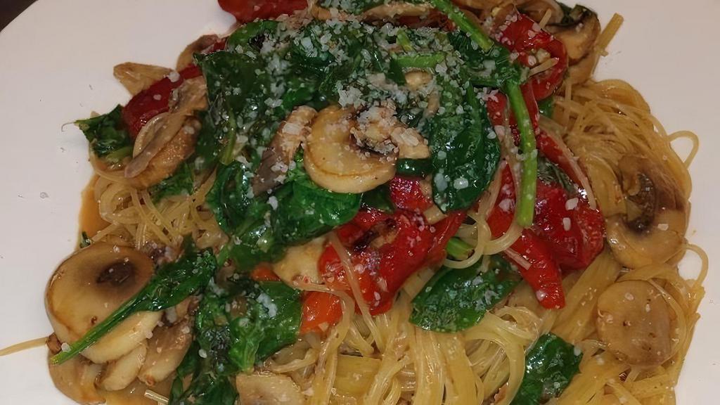 Lemon Angel Hair Pasta · Thin al dente angel hair with earthy sliced mushrooms, fresh spinach, roasted red peppers tossed in a rich garlic lemon butter sauce.