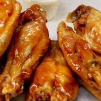 20 Wings · Our famous hand tossed Chicken wings, lightly breaded and packed with flavor tossed in your ...