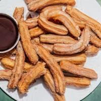 Churros · Filled with strawberry or caramel.
