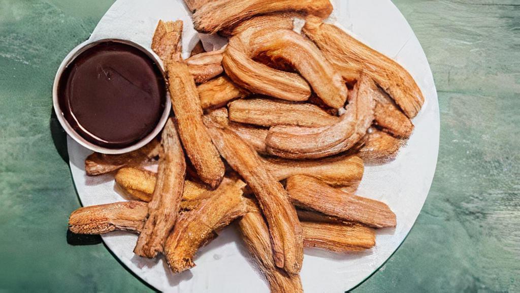 Churros · Filled with strawberry or caramel.