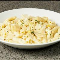 Penne Alfredo · Penne pasta with a  garlic parmesan cream sauce, choice of chicken, shrimp, or salmon.