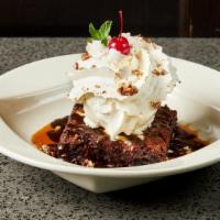 Small Signature Brownie · hot fudge, Woodford Reserve caramel sauce, vanilla ice cream, whipped topping, candied pecans.