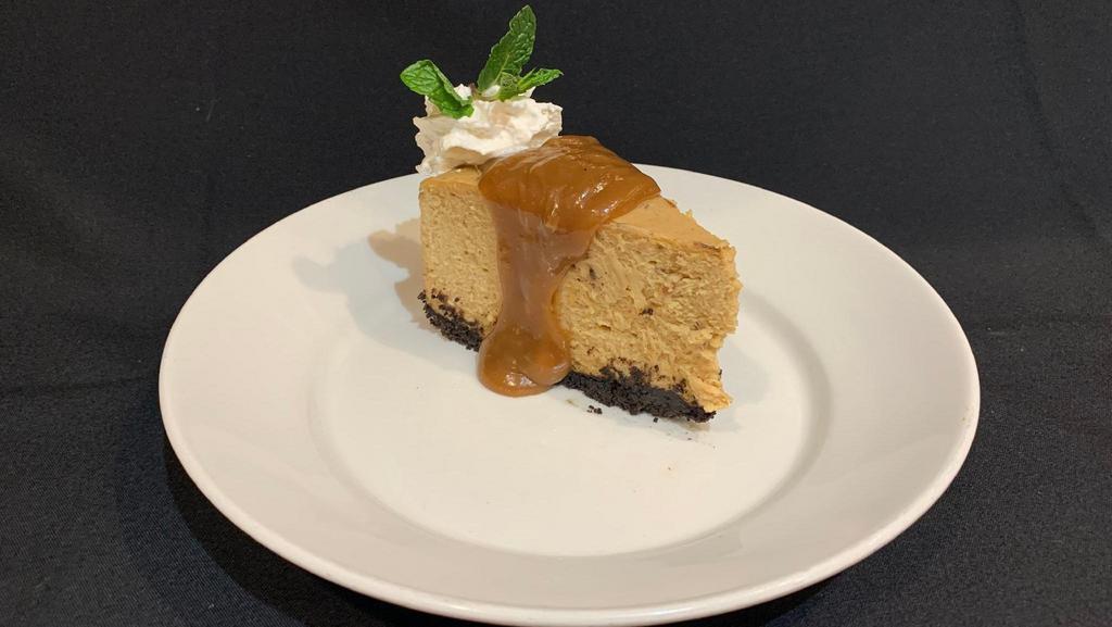 Peanut Butter Pie · Homemade brownie crumb crust filled with creamy, rich peanut butter filling topped with a peanut butter sauce, whipped cream and mint garnish.