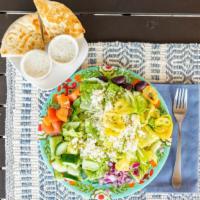 Greek Salad · Lettuce greens with tomatoes, cucumbers, banana peppers, kalamata olives, Feta cheese, and o...