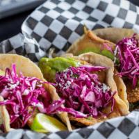 Crispy Fish Tacos · 3 Fried Tilapia Tacos with Cilantro-Green Onion Sauce and Rajas (Grilled Poblano Peppers) on...