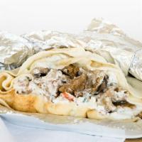 Gyro · Ground beef and lamb mixed with spices, slowly cooked and thinly sliced, topped with
tomatoe...