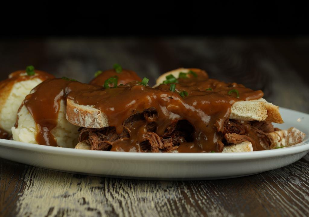 Hot Roast Beef Sandwich · Slow Roasted Beef served on two slices of bread with Mashed Potatoes and Gravy.