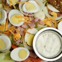 Combination Salad · Fresh lettuce, tomatoes, onions, cucumbers, ham, cheese, green peppers, hard boiled eggs ser...