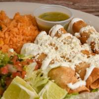 Tacos Dorados · Four fried flautas stuffed with chicken topped with lettuce, cheese, sour cream, pico de gal...