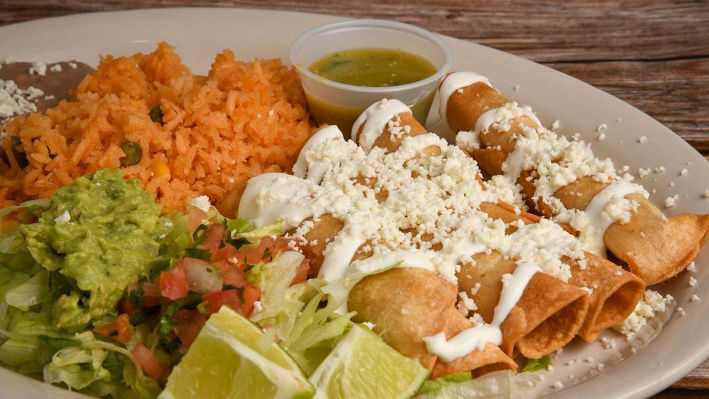 Tacos Dorados · Four fried flautas stuffed with chicken topped with lettuce, cheese, sour cream, pico de gallo and guacamole.