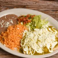 Enchiladas Verdes · Three enchiladas covered in green salsa and stuffed with chicken topped with lettuce, cheese...