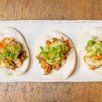 Steam Buns · pulled pork, soy chili sauce, sambal mayo, cucumber, chive