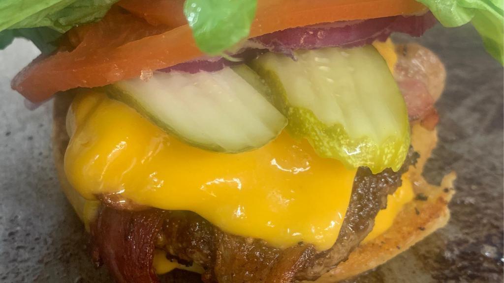 Oinkymoo · 1/3 LB Angus beef patty and bacon with your choice of cheese and your choice of toppings on a toasted bun or lettuce wrapped