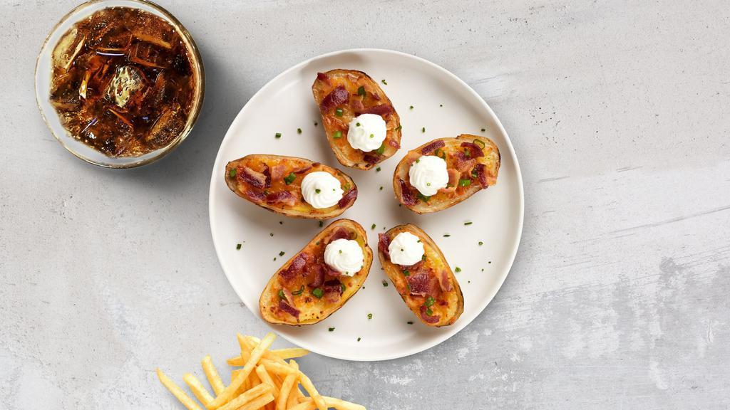 Potato Skins · Baked potato skins filled with bacon, cheddar cheese and sour cream.