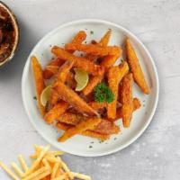 Sweet Potato Fries · (Vegetarian) Thick-cut sweet potato wedges fried until golden brown.