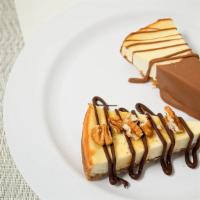 Cheesecake · A classic cheesecake made with real cream cheese and a graham cracker crust, drizzled in our...