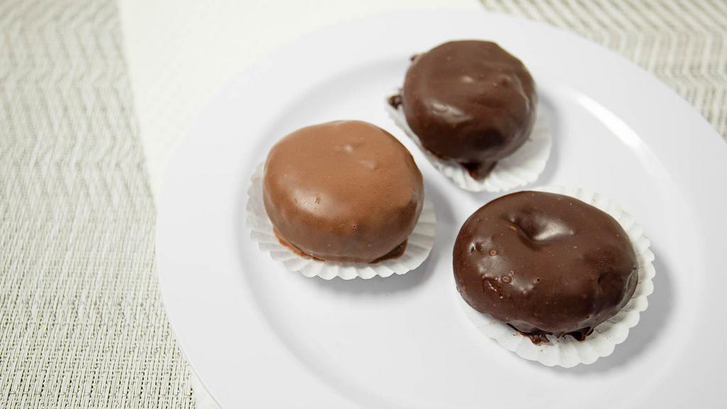 Chocolate Donuts · Cinnamon cake doughnuts dipped in milk or dark chocolate.