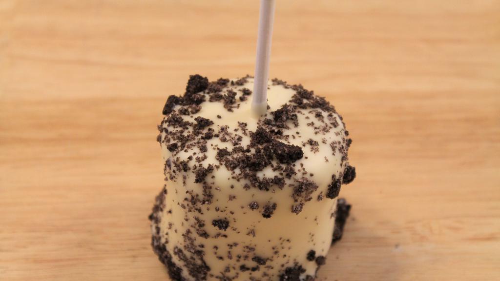 Cookies & Cream Marshmallows · White chocolate dipped marshmallow topped with oreo crumbs.