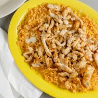 Arroz Con Pollo · Cooked Mexican rice with grilled chicken covered with white queso sauce and served with soft...