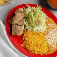 Carnitas · Delicious fried pork with rice and beans, salad, and tortillas.