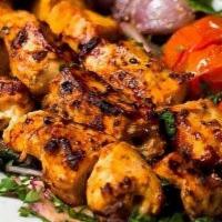 Shish Tawook · grilled chicken, cucumber, tomato, onion lettuce with tahini or garlic sauce.