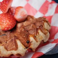 The Queen · Our Crown style waffle served with strawberries or blueberries* and whipped cream (*Compote ...